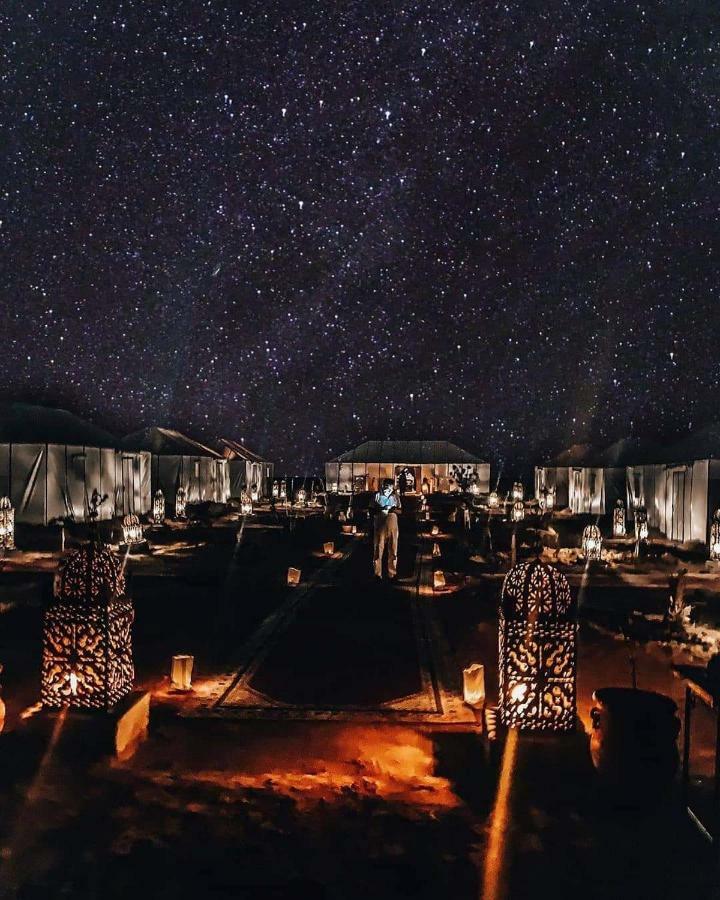 Sahara Majestic Luxury Camp Hotel Merzouga Exterior photo The camp at night
